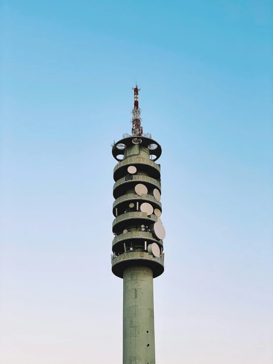 a tower in the city with lots of plates stacked on top