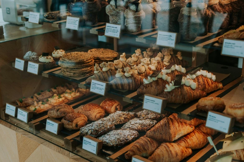 a bakery window with various pastry items in display