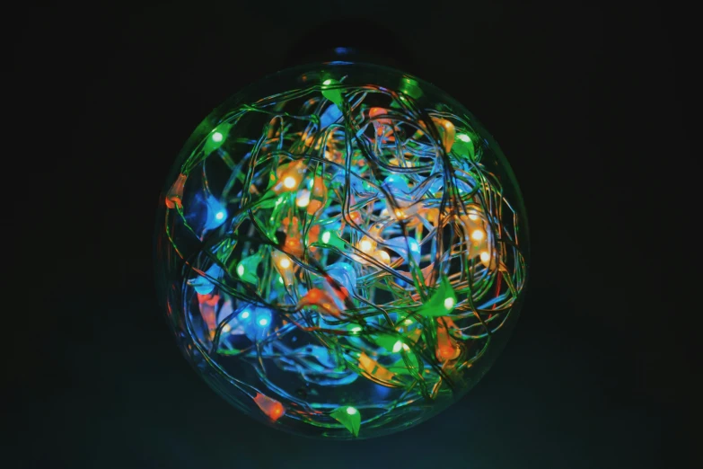 a lit up ball of wire wrapped around the globe