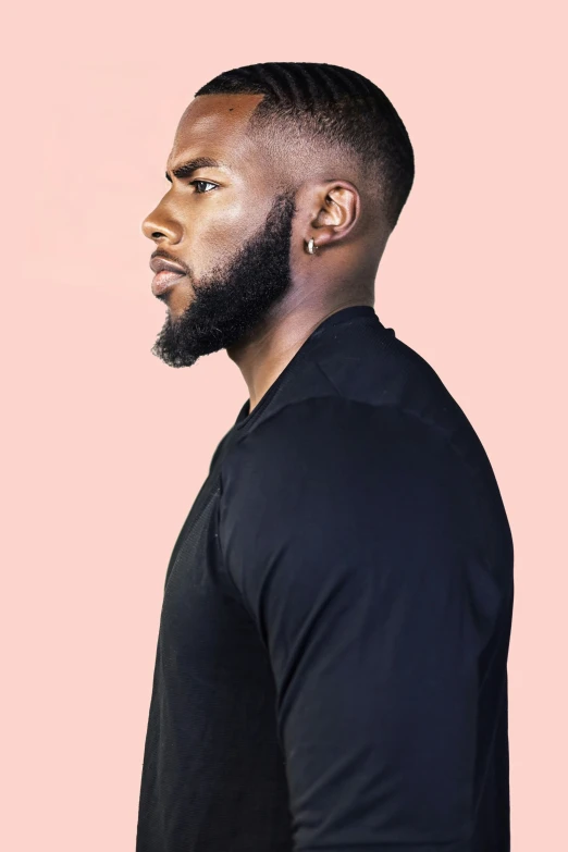 black man with a beard and a dark top