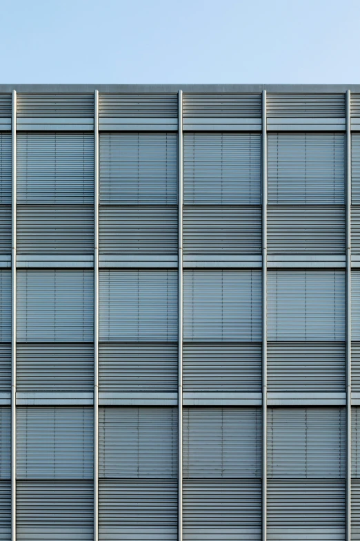 a building that has shuttered into the side with a clock