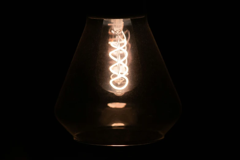 a closeup image of a light bulb in the dark