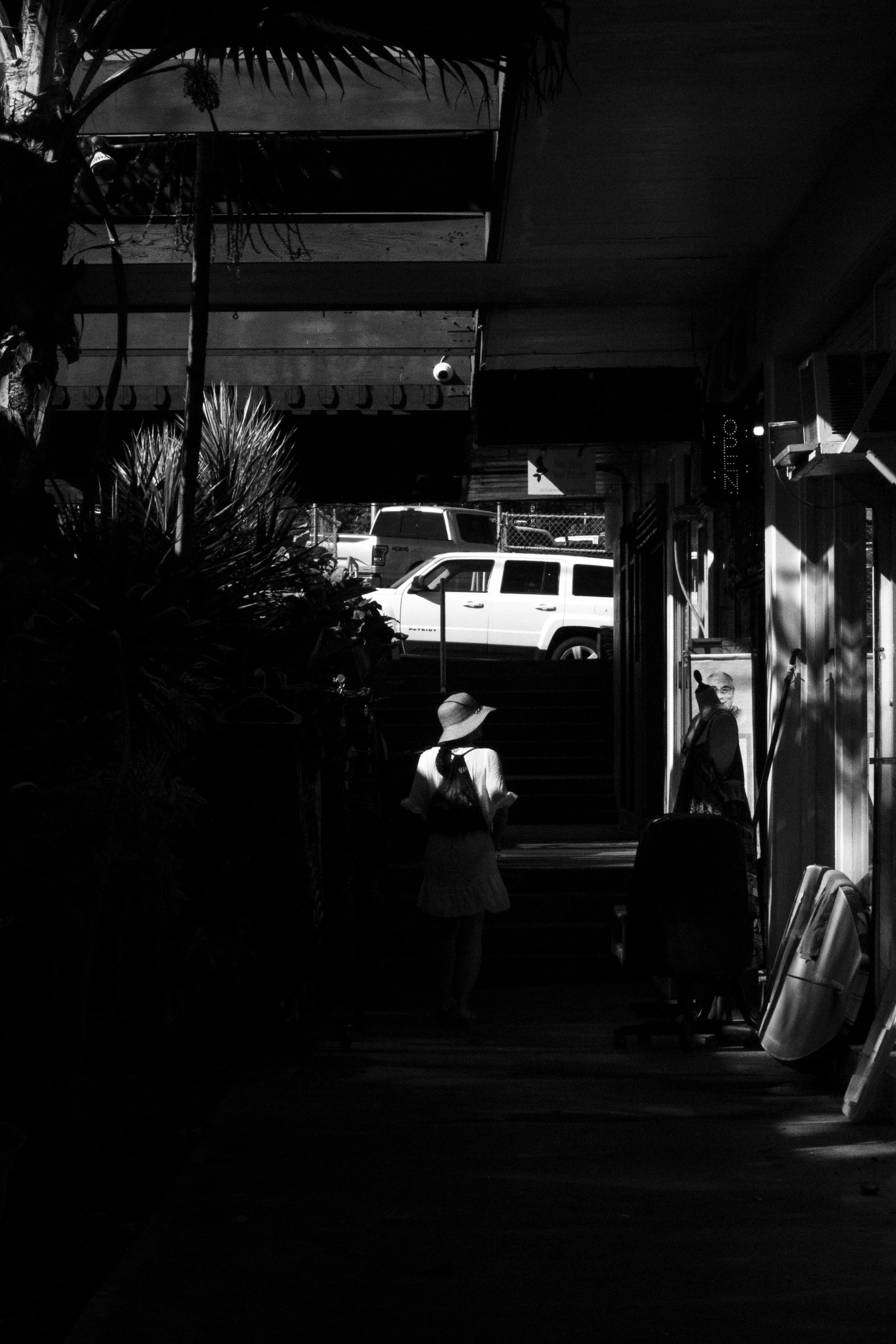 black and white po of people on walkway in dark area