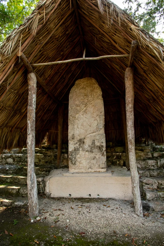 there is a small shelter built around an old grave