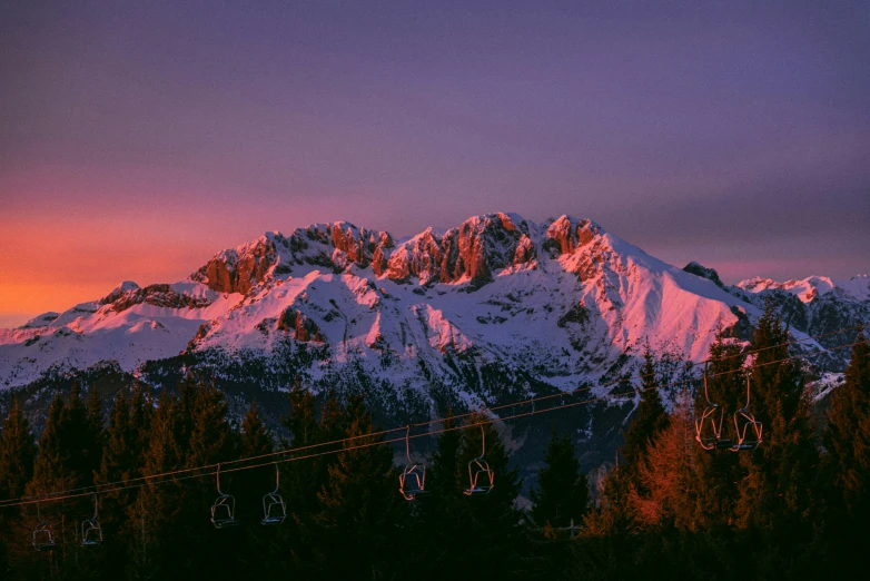 a ski lift on the side of a mountain