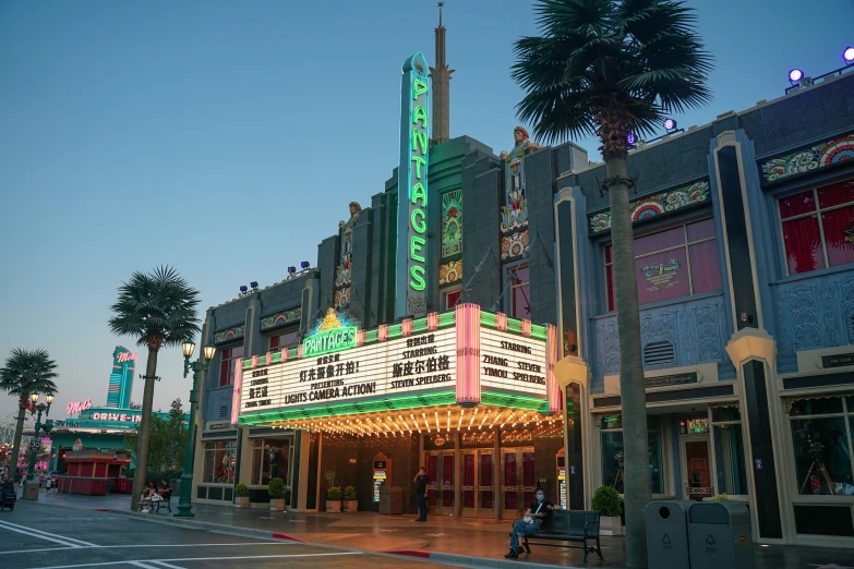 a building in the evening with palm trees