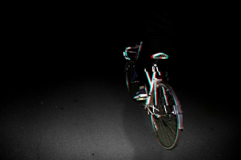 a bicycle on a dark background with red and white lights