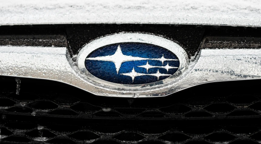 a close up of the front badge and grill of an suv