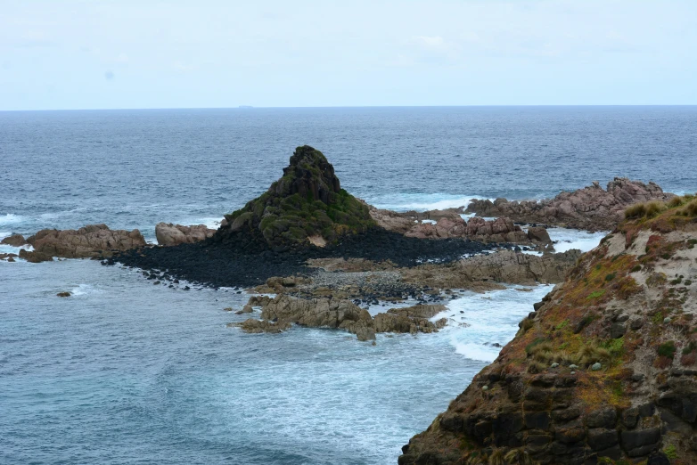 a view of a body of water with small waves