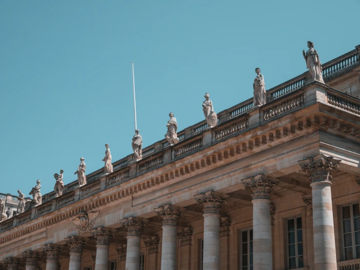 stone building with intricate balcony detailing and columns