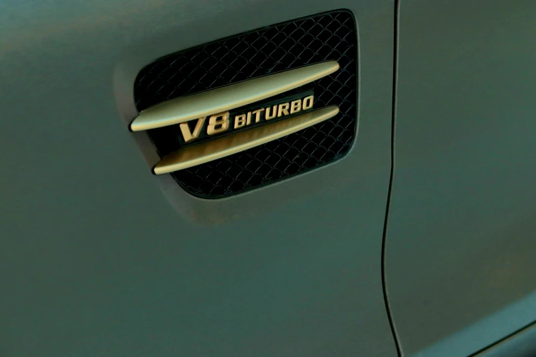 a car badge sitting on the side of a vehicle