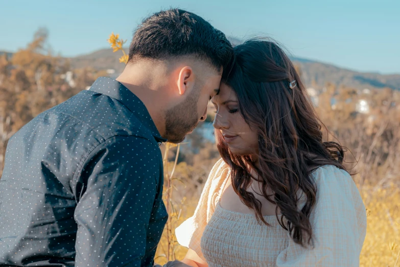 a man and a woman are standing next to each other