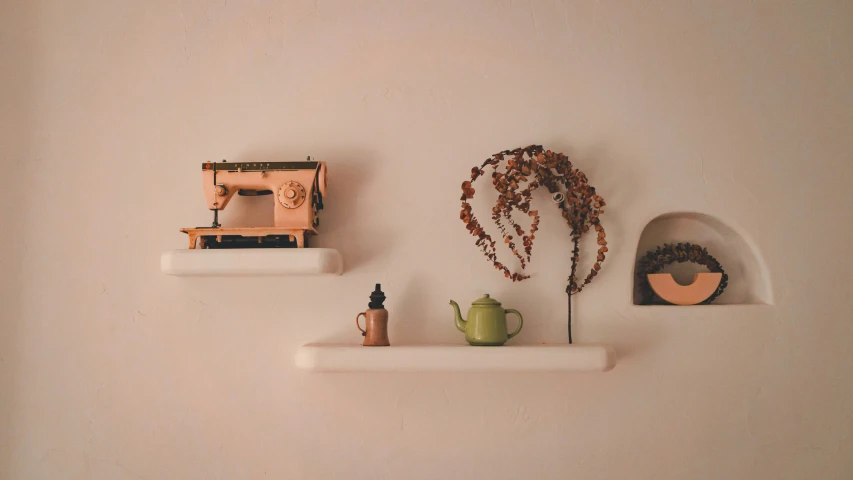 a pair of shelves with a sewing machine on one shelf