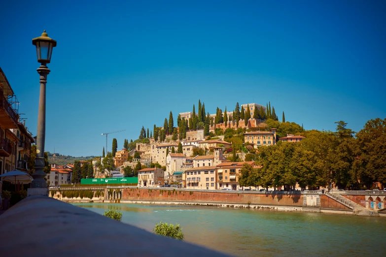 city on the bank with a river in front of it