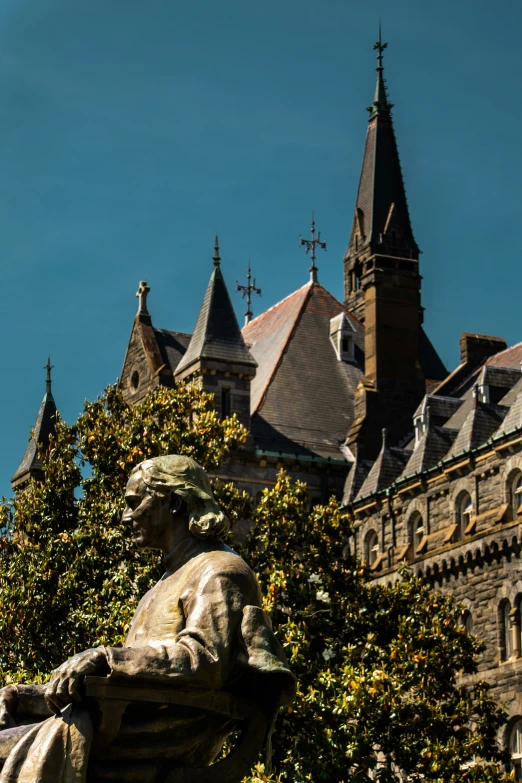 an image of a statue with the clock in front of it