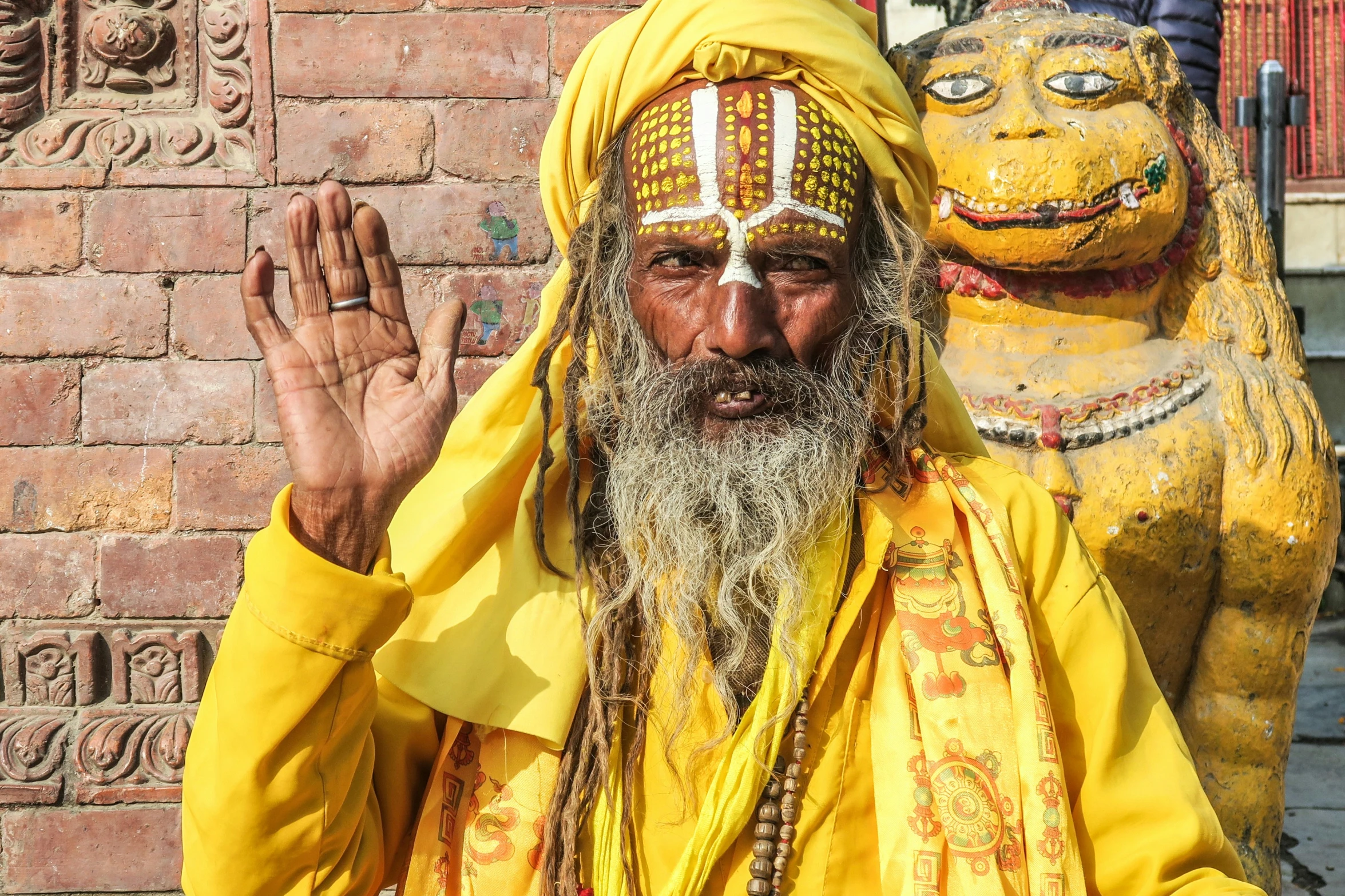 an older man in yellow wearing a golden outfit