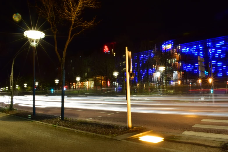 a street with light streaks shining down the street