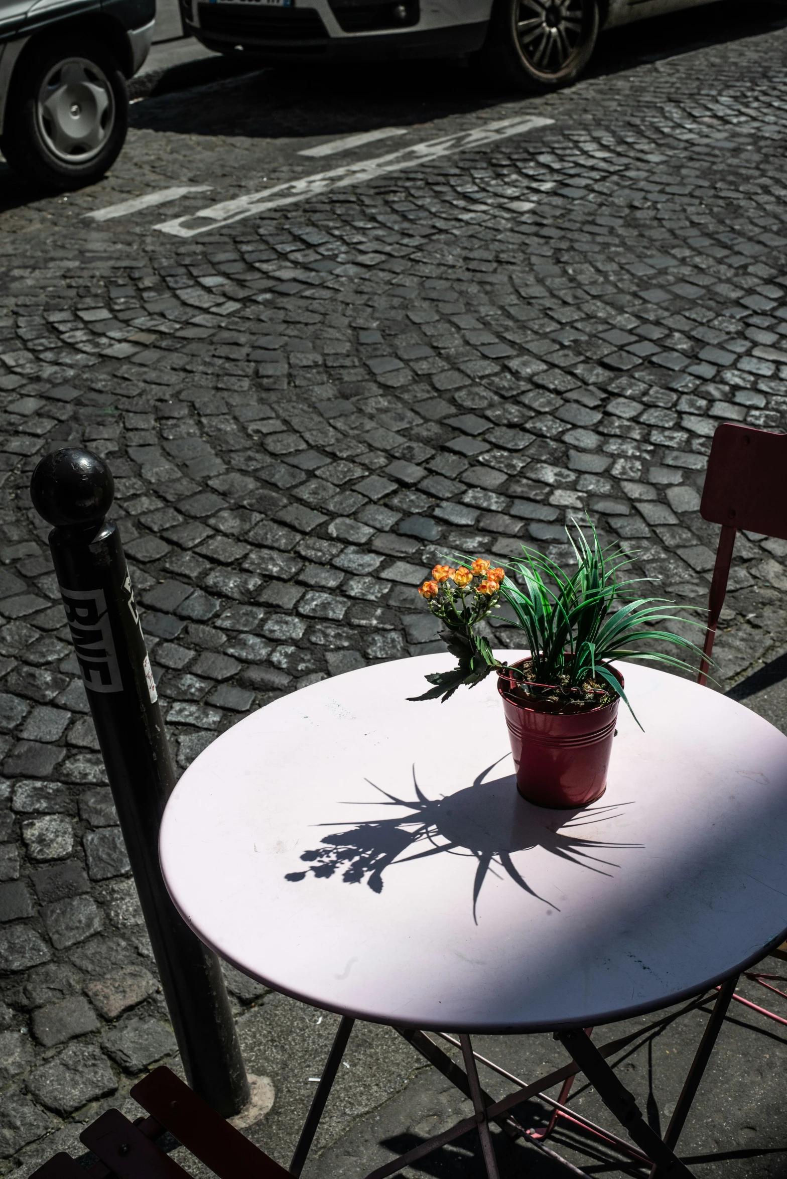 a table with a flower pot sitting on it