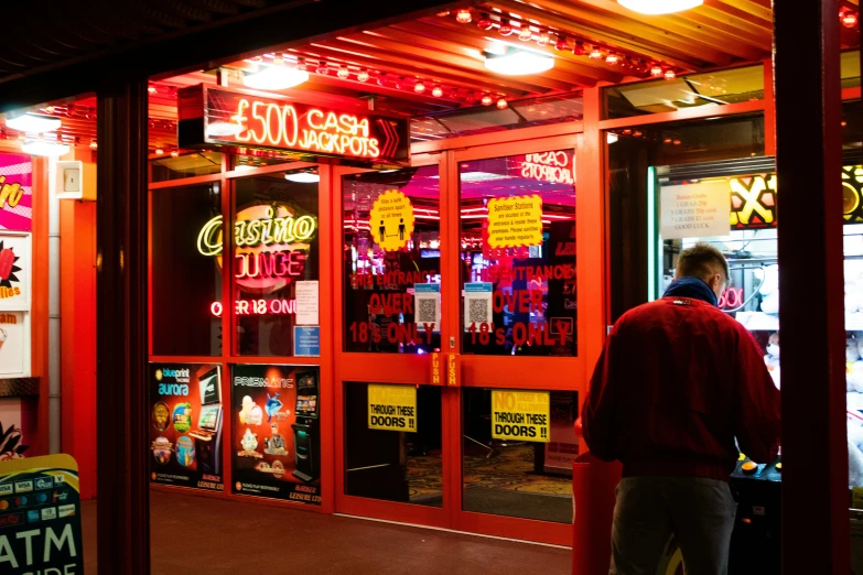 a neon storefront with neon signs inside