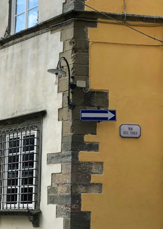 a sign on a street corner in paris