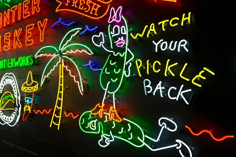 colorful neon sign displays holiday scenes and signs