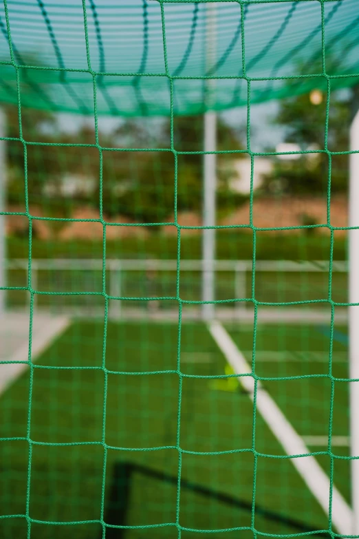 there are some tennis balls sitting in the net