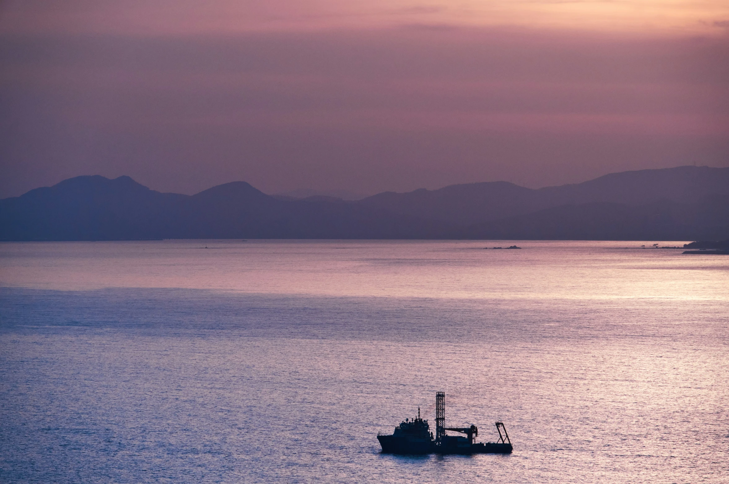 a small boat in a large body of water