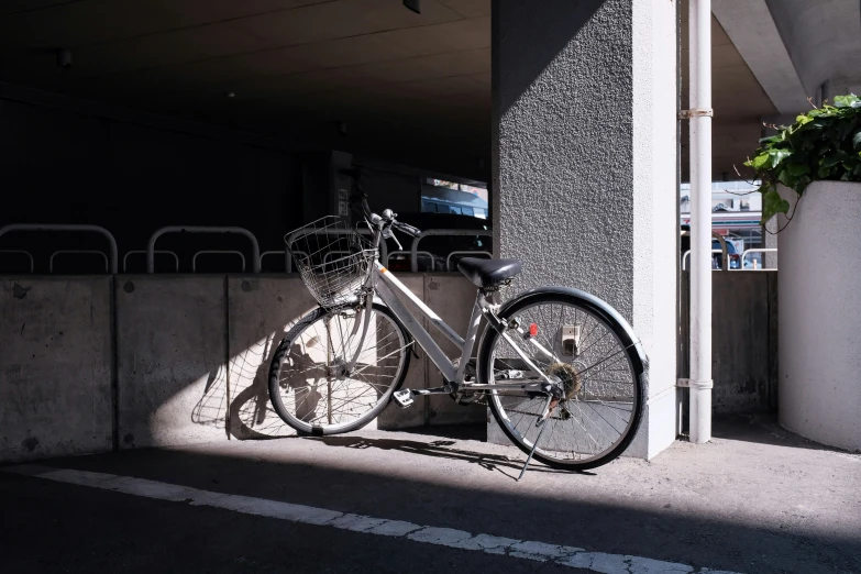 a bicycle parked in a building with another bike