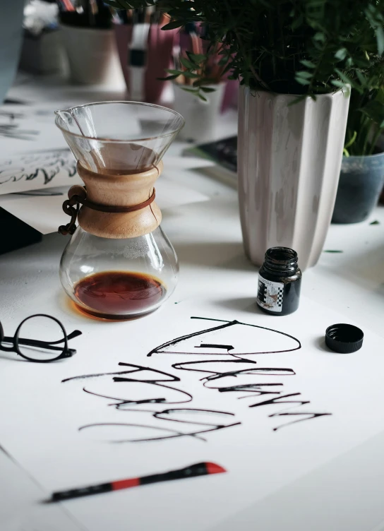 an image of scissors, some ink and flowers