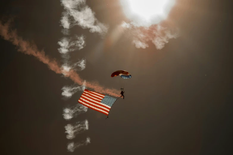 a person para sailing with an american flag kite