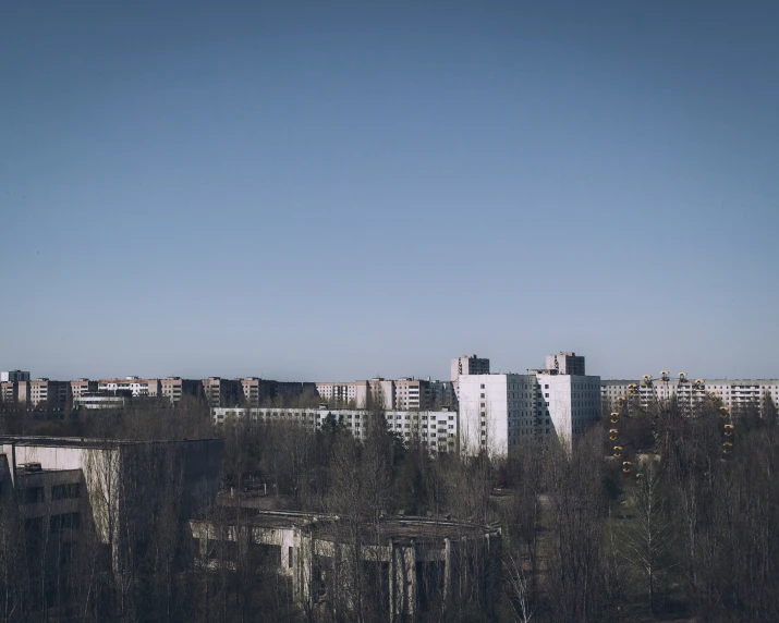 there is a clock tower above the buildings