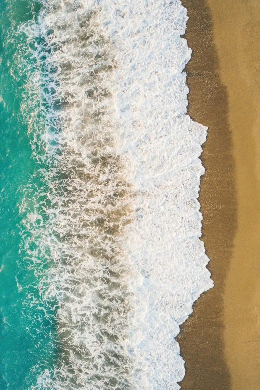 two beach - side pos with different colors of water