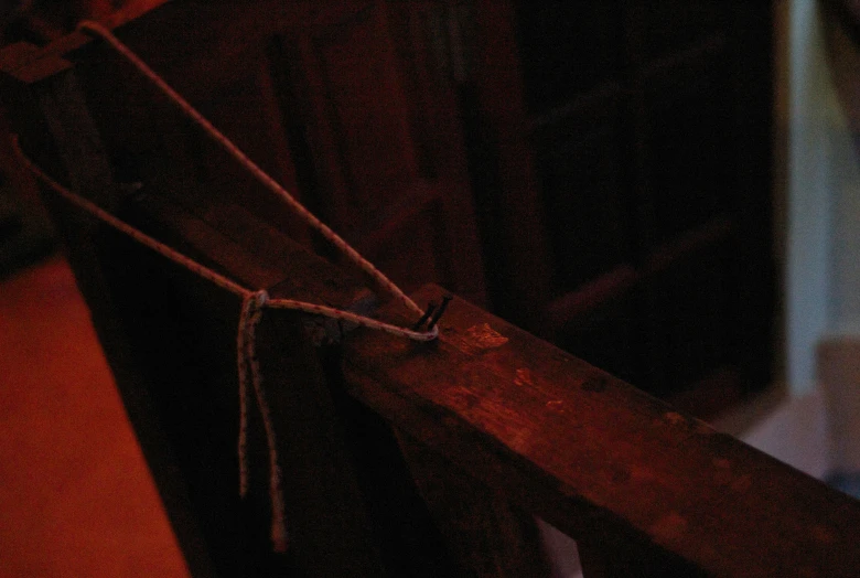 a long knife is on a wooden counter