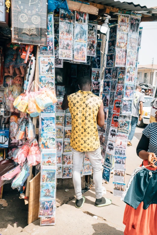 a man that is standing in front of a store