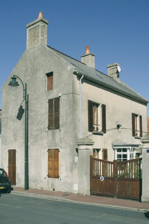 a house with two cars parked in front