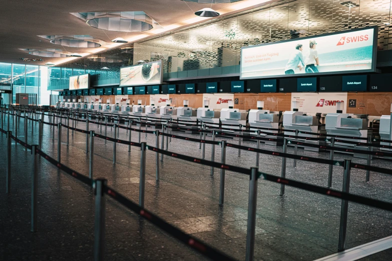 a view of an empty airport terminal with the luggage line