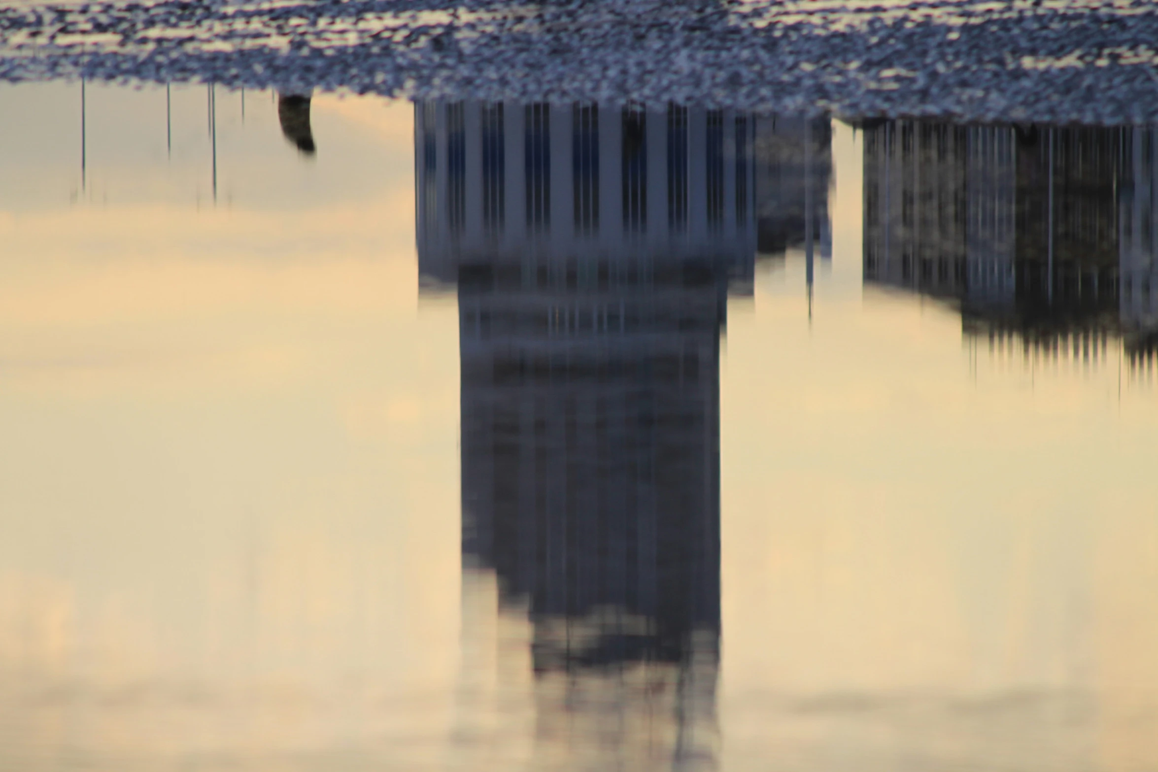 a reflection of the big ben tower in water