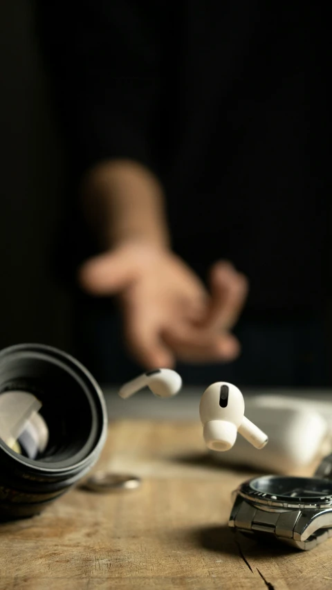 a wooden table with headphones sitting on top of it