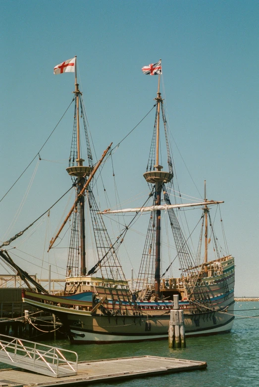 this is a sail boat that was docked at a pier