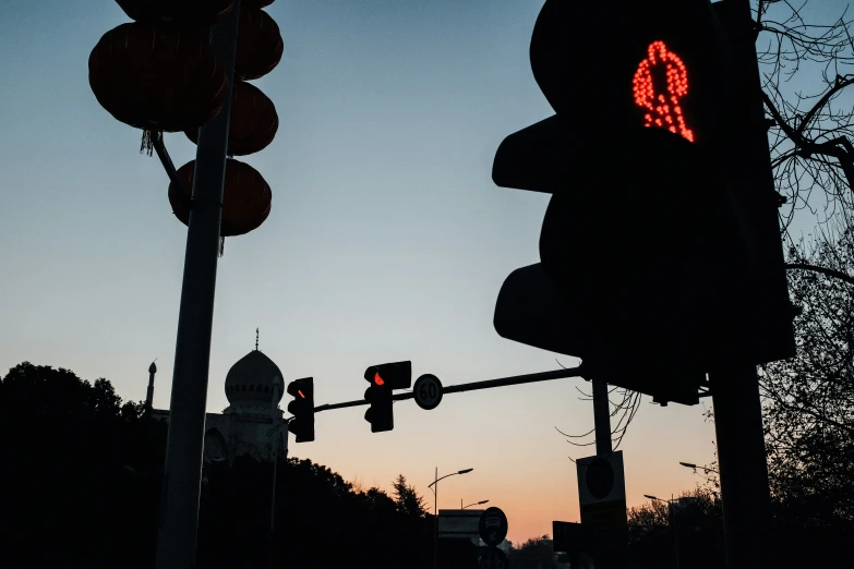 a street light with a lit up sign on it