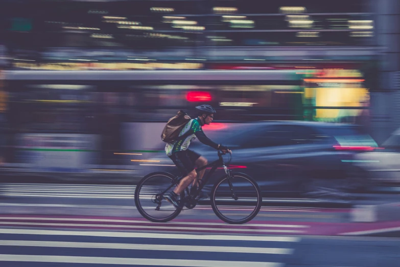 a man on a bike with red lights