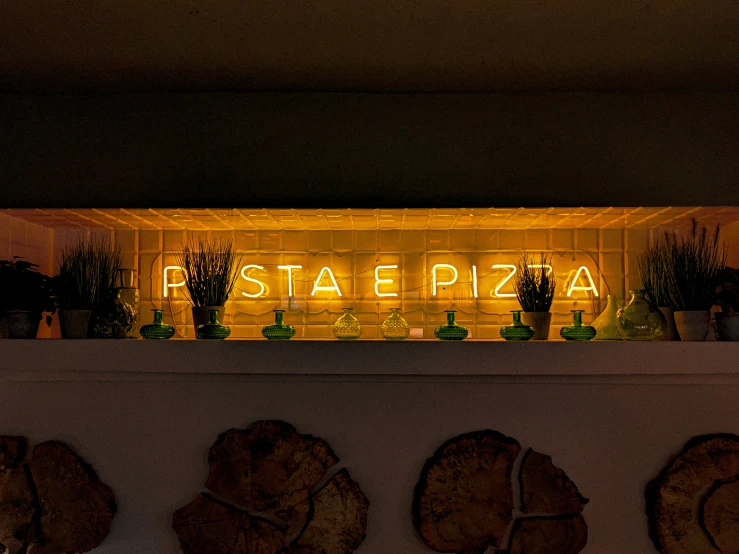 the words f stae plaza are lit up at night