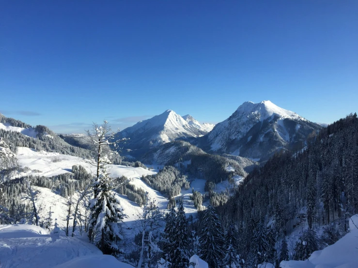 a person standing on top of a ski slope