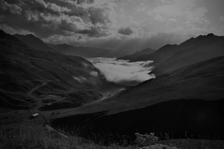 clouds are shown in the valley and over the hills