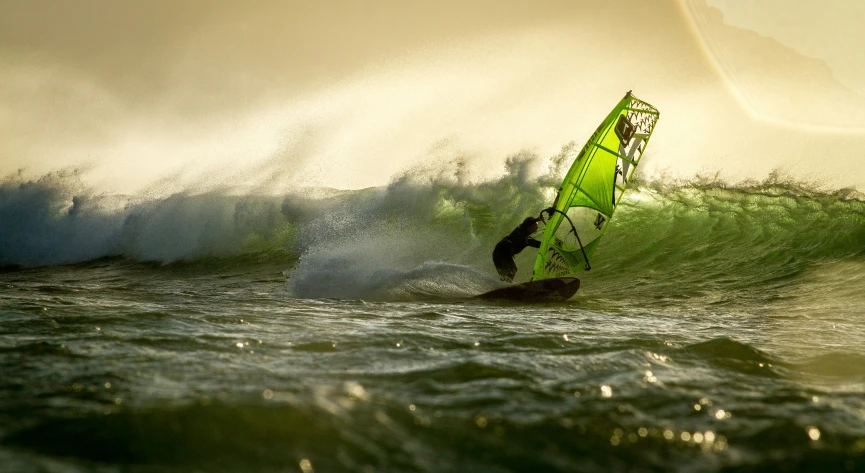 a man windsurfing a wave in the ocean