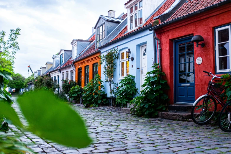 several buildings are painted different colors and are lined up