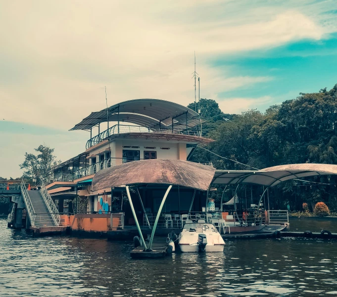 boats in water next to buildings on dock