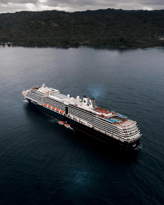 large cruise ship in the water during storm weather