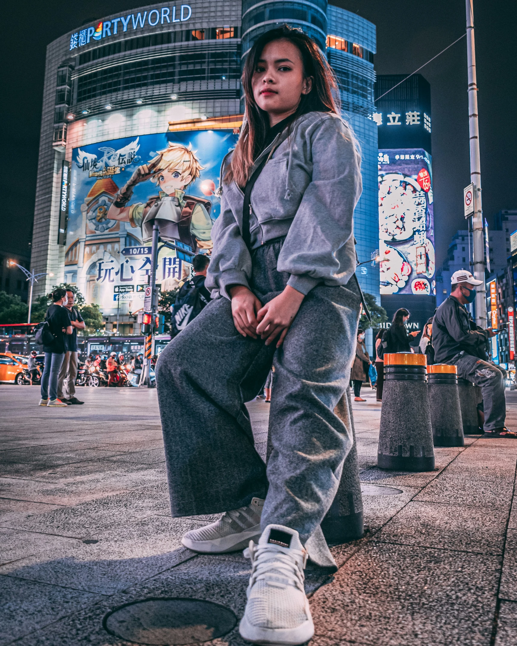 a woman posing for a po in front of a building