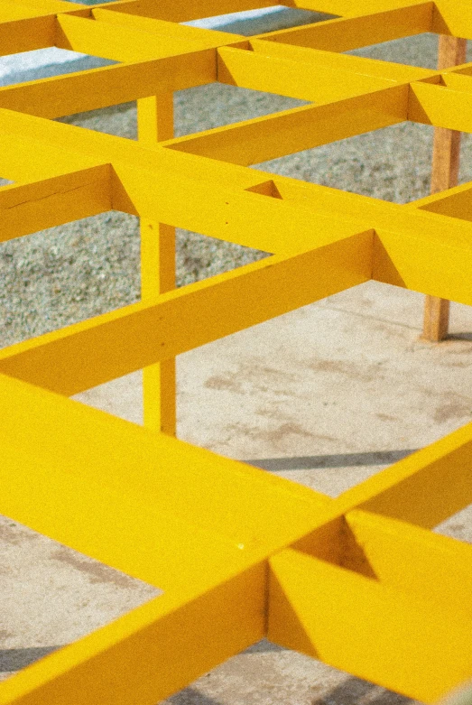 a picture of some yellow metal benches